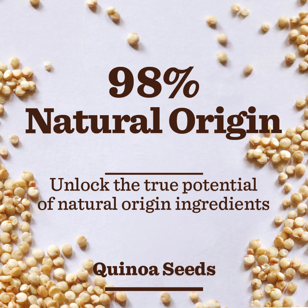 Quinoa seeds scattered on a white surface with text: 98% Natural Origin. Sensitive Face Scrub—unleash the true power of natural origin ingredients, perfect even for sensitive skin.