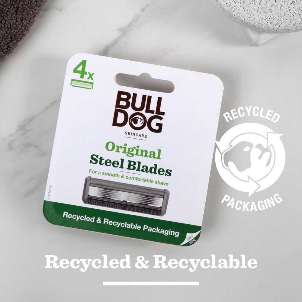 A pack of Original Steel Blades rests on a white surface, displaying Recycled & Recyclable Packaging text with a recycling symbol. The pack includes 4 blades.