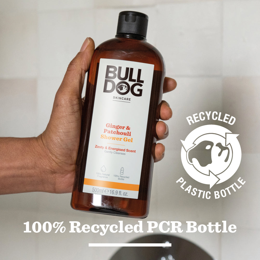 A hand holds a bottle of Ginger & Patchouli Shower Gel with a natural fragrance. Beside it is a Recycled Plastic Bottle symbol. Text at the bottom states: 100% Recycled PCR Bottle.