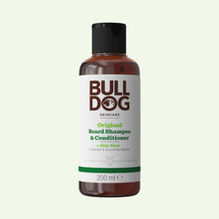 A 200 ml bottle of Original Beard Shampoo and Conditioner for men with natural origin ingredients and Aloe Vera, in a brown bottle with a black cap and a white label featuring green and brown text.