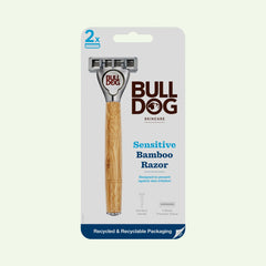 The Sensitive Bamboo Razor is shown in its packaging, featuring a bamboo handle and two sensitive steel blades. The eco-friendly packaging highlights recycled materials and skin irritation prevention.