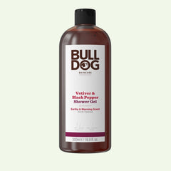 A 500ml bottle of Vetiver & Black Pepper Shower Gel for men, featuring a natural earthy fragrance. The black-capped bottle displays white and maroon text on a white label.