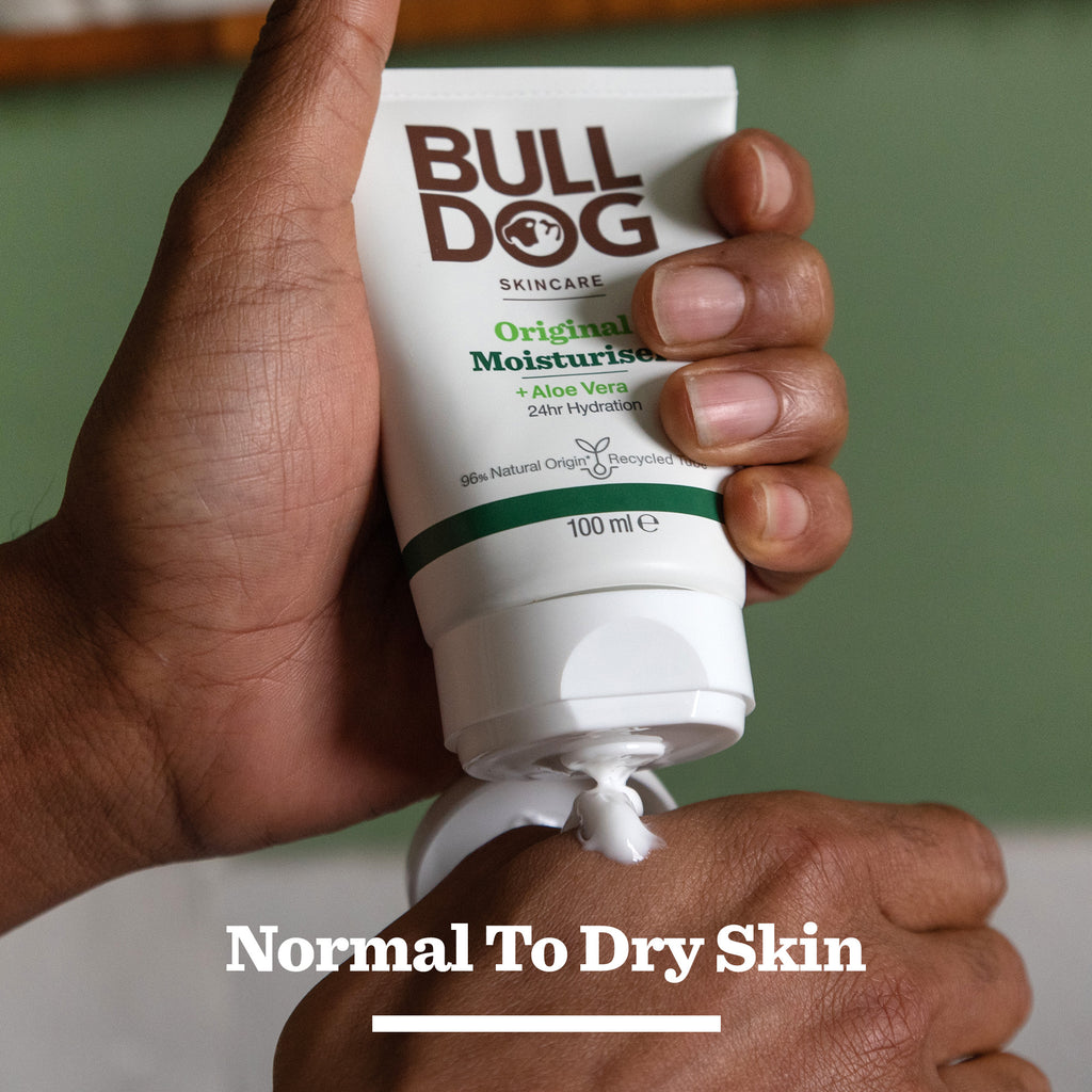 A person squeezes Original Moisturiser Cracker onto their hand, with text below reading Normal To Dry Skin—making it an ideal gift for men who value self-care.