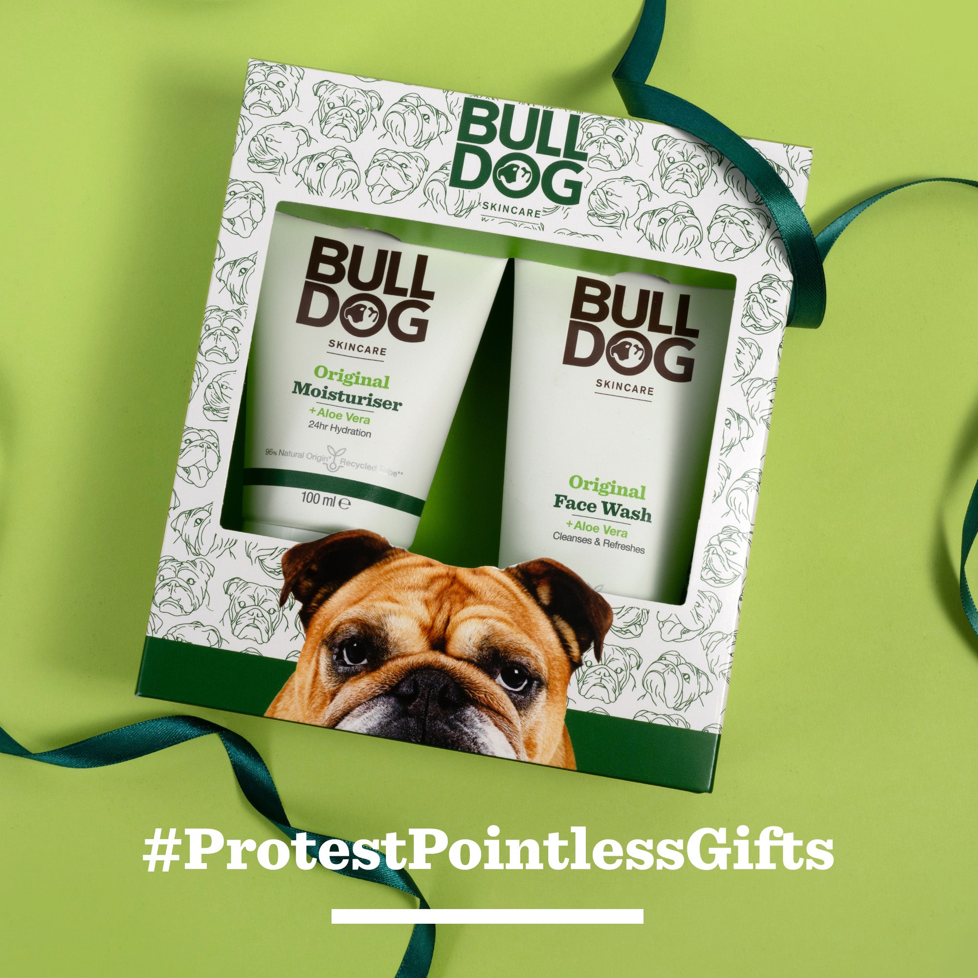 The Original Skincare Duo gift set features moisturiser and face wash in a box with a cartoon bulldog and green ribbon on a green background. Text: #ProtestPointlessGifts—perfect for men who value self-care.