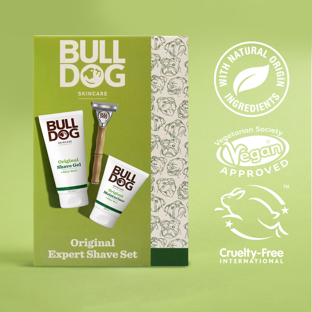 The Expert Shave Trio box features a shave gel, moisturizer, and bamboo razor, with icons for natural origin ingredients, vegan approval, and cruelty-free certification on a green background.