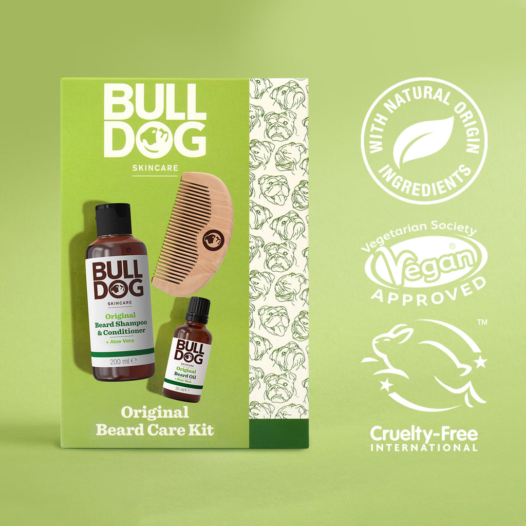 The Original Beard Care Kit includes beard shampoo & conditioner, oil, and a wooden comb. Vegan, cruelty-free, made with natural ingredients. Features green packaging with dog illustrations.