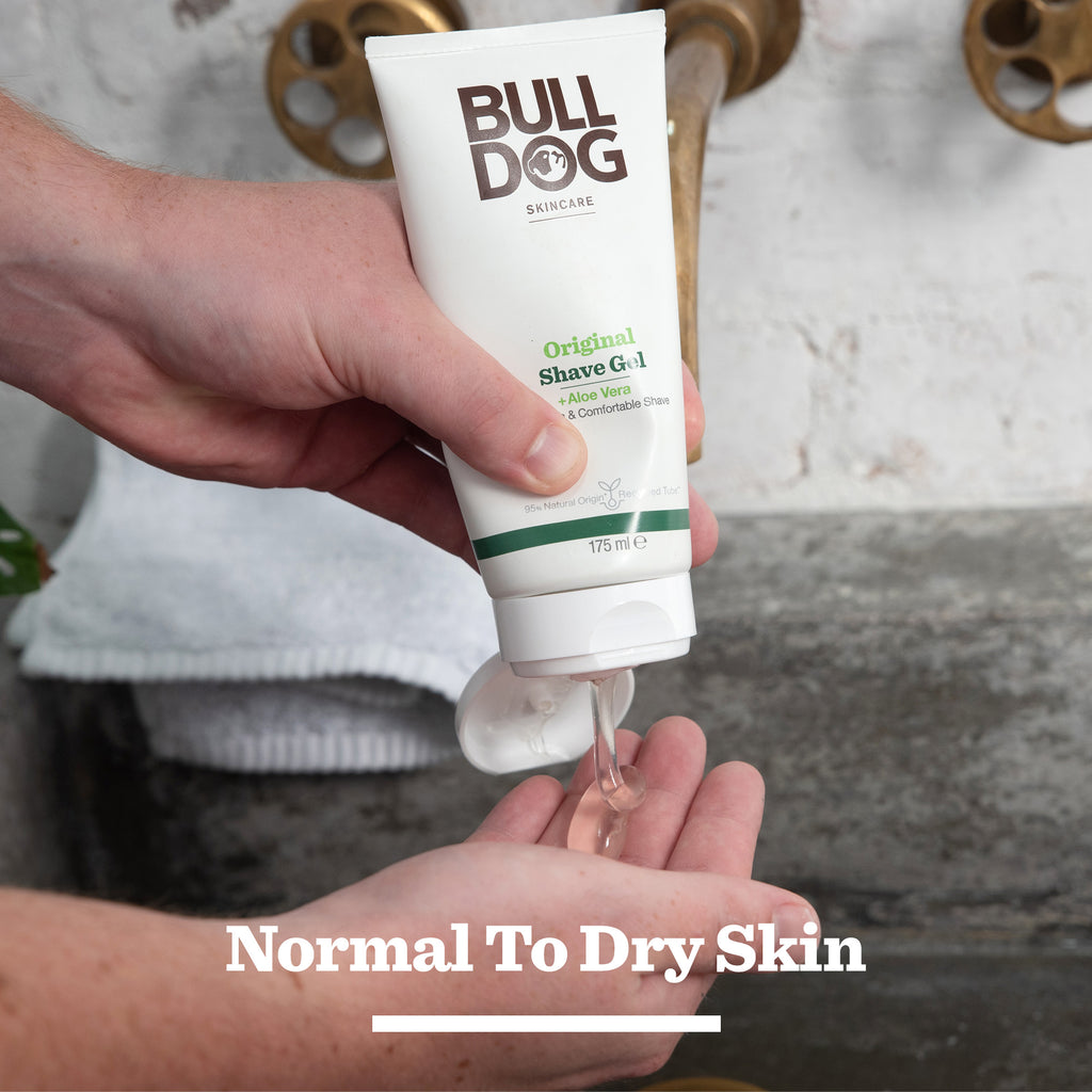 A person squeezes the Original Shave Duo into their hand over the bathroom sink, pairing it with a Bamboo Razor for a smooth shave. The product is designed for normal to dry skin.