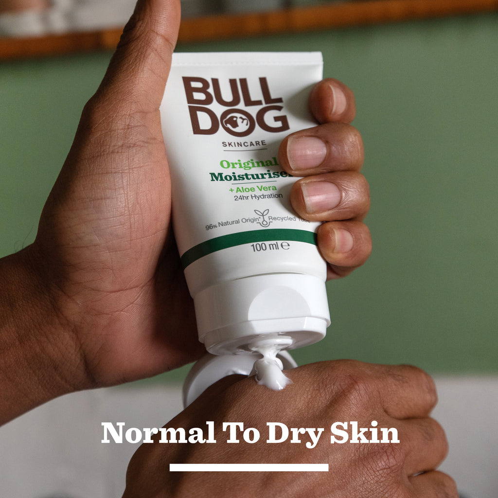 A person squeezes Bulldog Skincare Original Morning Routine into their hand, highlighting this essential for Normal To Dry Skin—an ideal addition to any Bulldog Skincare men's gift set or thoughtful Christmas gift.