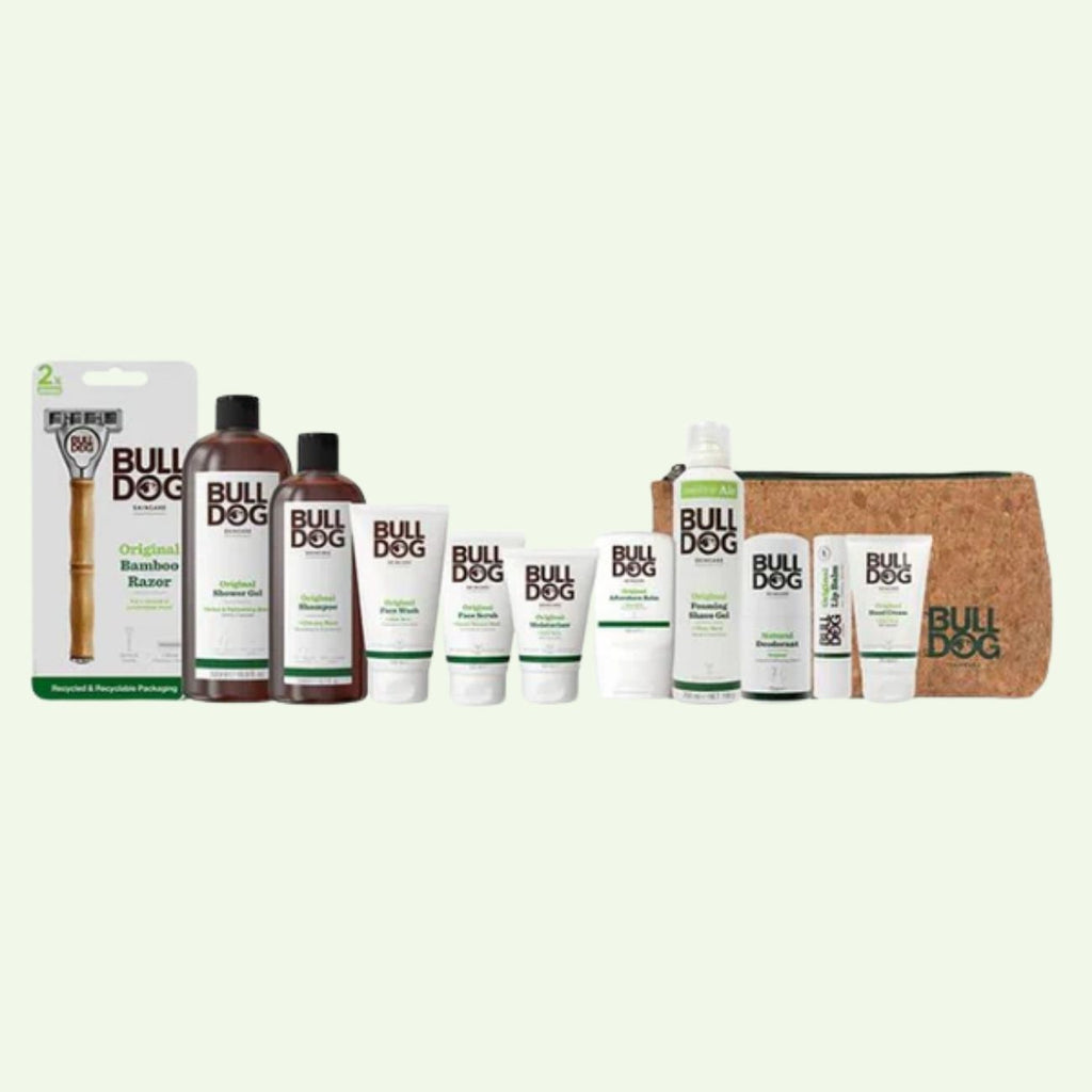 The Original Mega Bundle includes Bulldog skincare bottles, tubes, a Bamboo Razor in packaging, and a brown toiletry bag—all arranged in a row on a light background for your grooming routine.